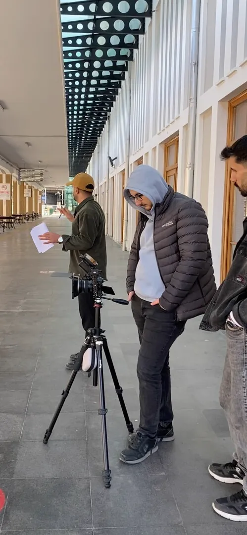 Setting up a tripod in a long corridor